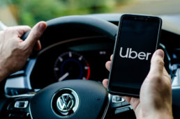 driver accessing the Uber app while driving