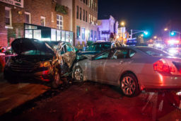 a nighttime car crash in the city