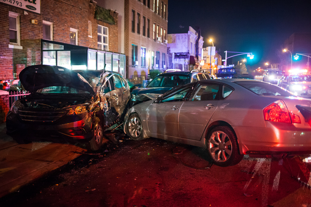 a nighttime car crash in the city