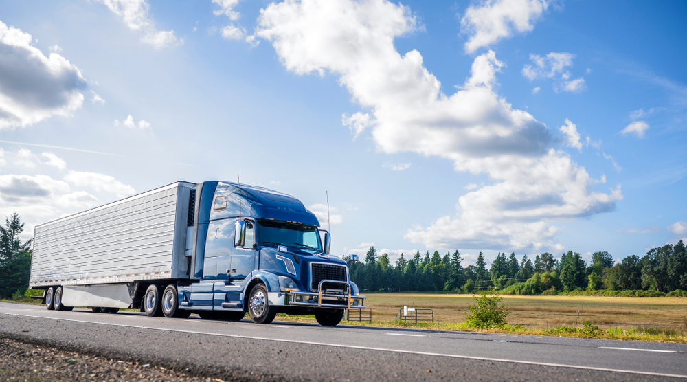 semi-truck driving down the road